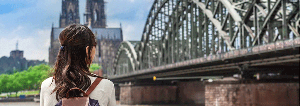 germany-cologne-rhine-bridge-woman-header