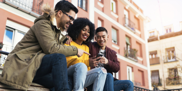 group of friends on phone in Europe