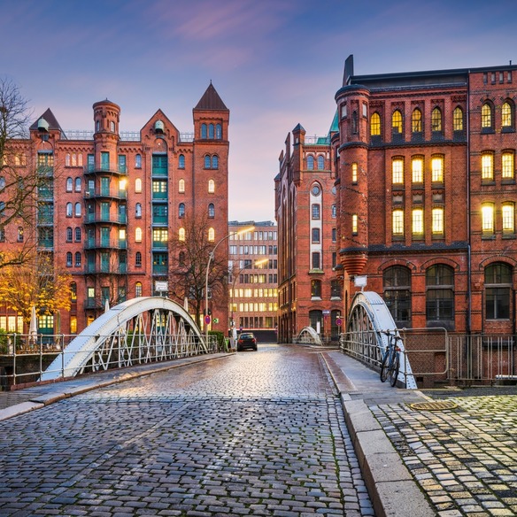 A bridge and two large brick buildings in Hamburg's historic warehouse district