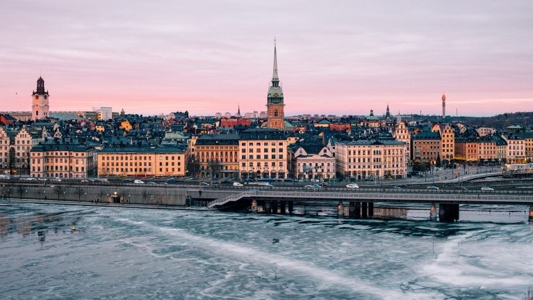 A landscape of Stockholm's skyline during a winter sunset