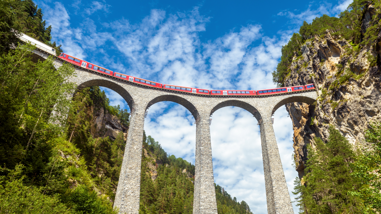 train-on-viaduct-switzerland-blue-sky